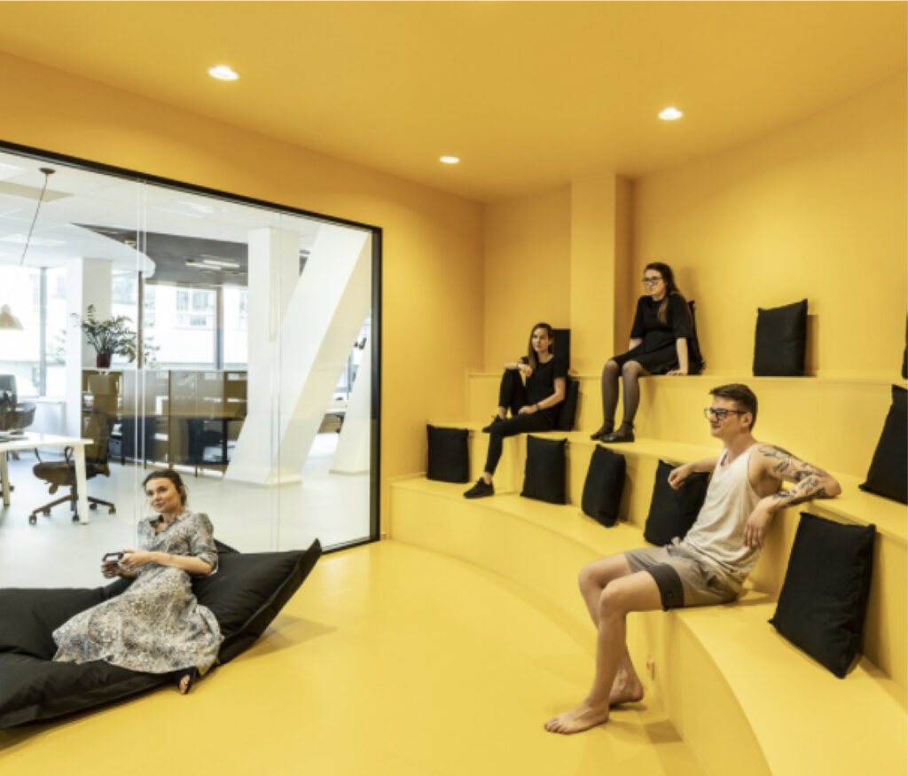 DDB Advertising Staff Members in a Yellow Conference Room