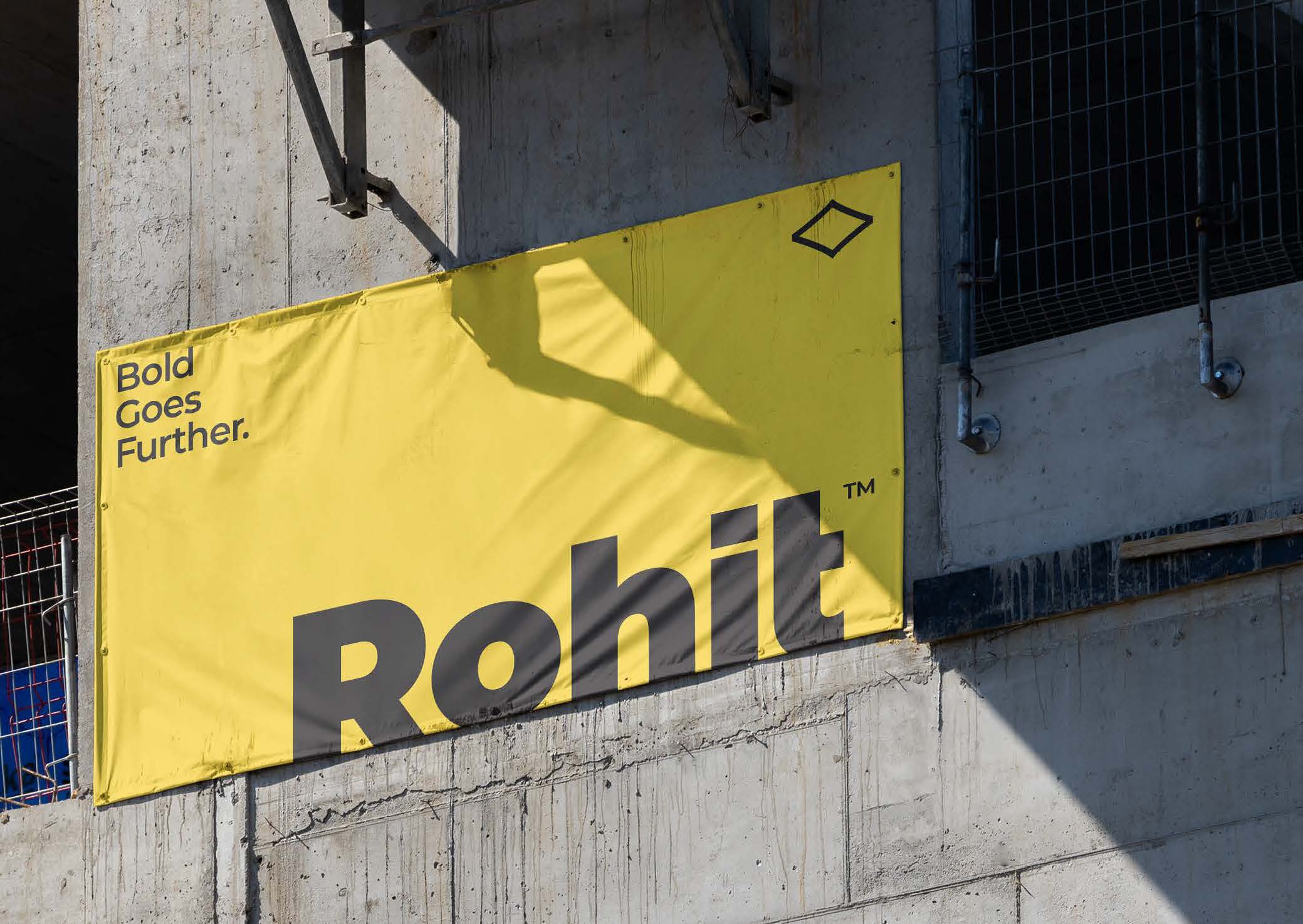 Yellow Rohit banner on a construction site with the slogan 